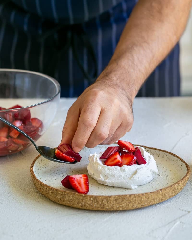 Placing the strawberry and rhubarb pieces around the plate