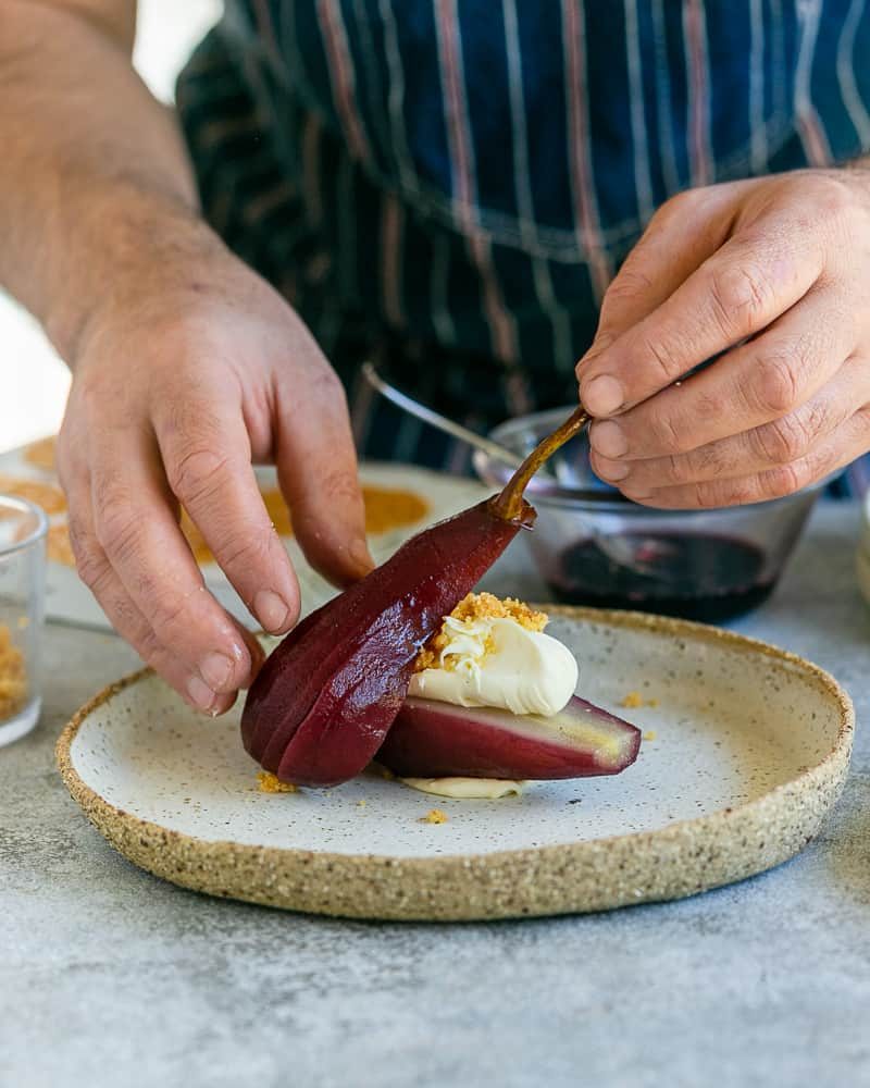 Placing the fan shaped pear against the pear with mascarpone