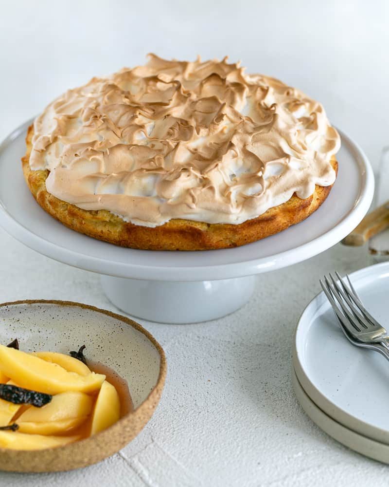 Quince Tart with Meringue on a cake stand