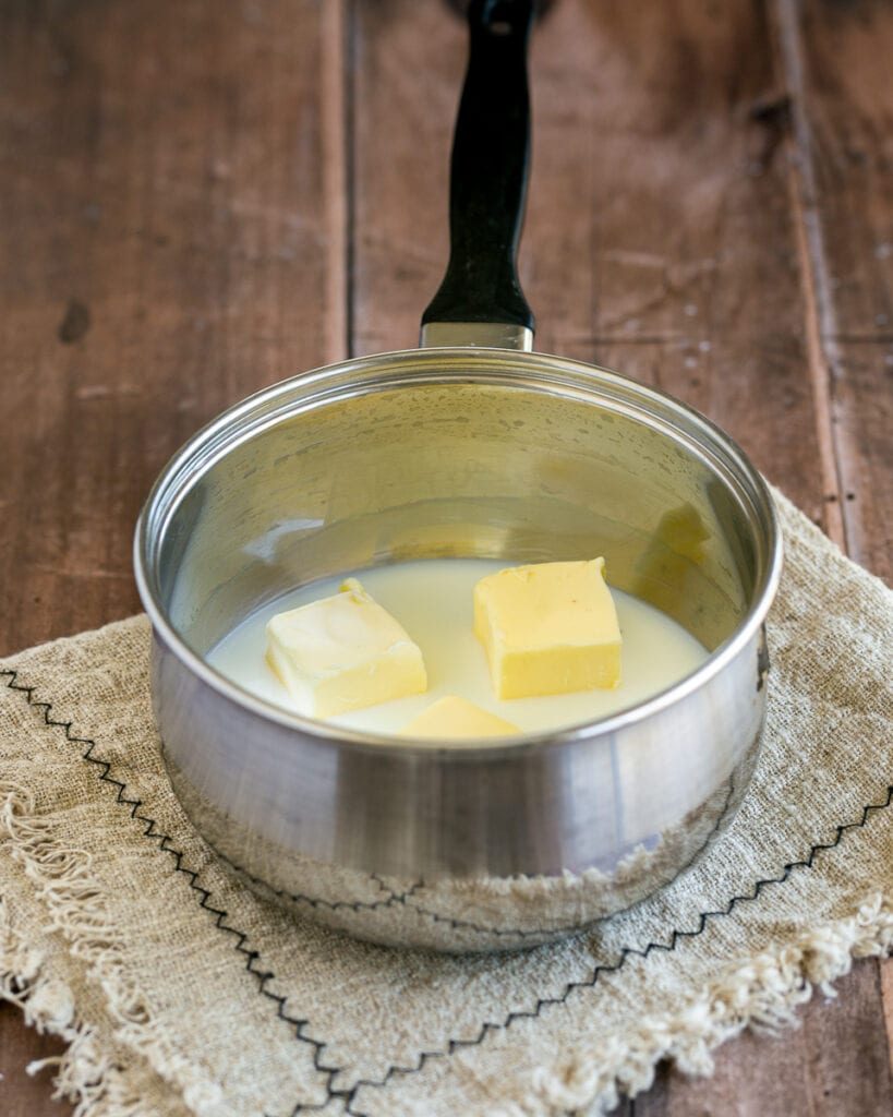 Butter and milk in a pot on a napkin