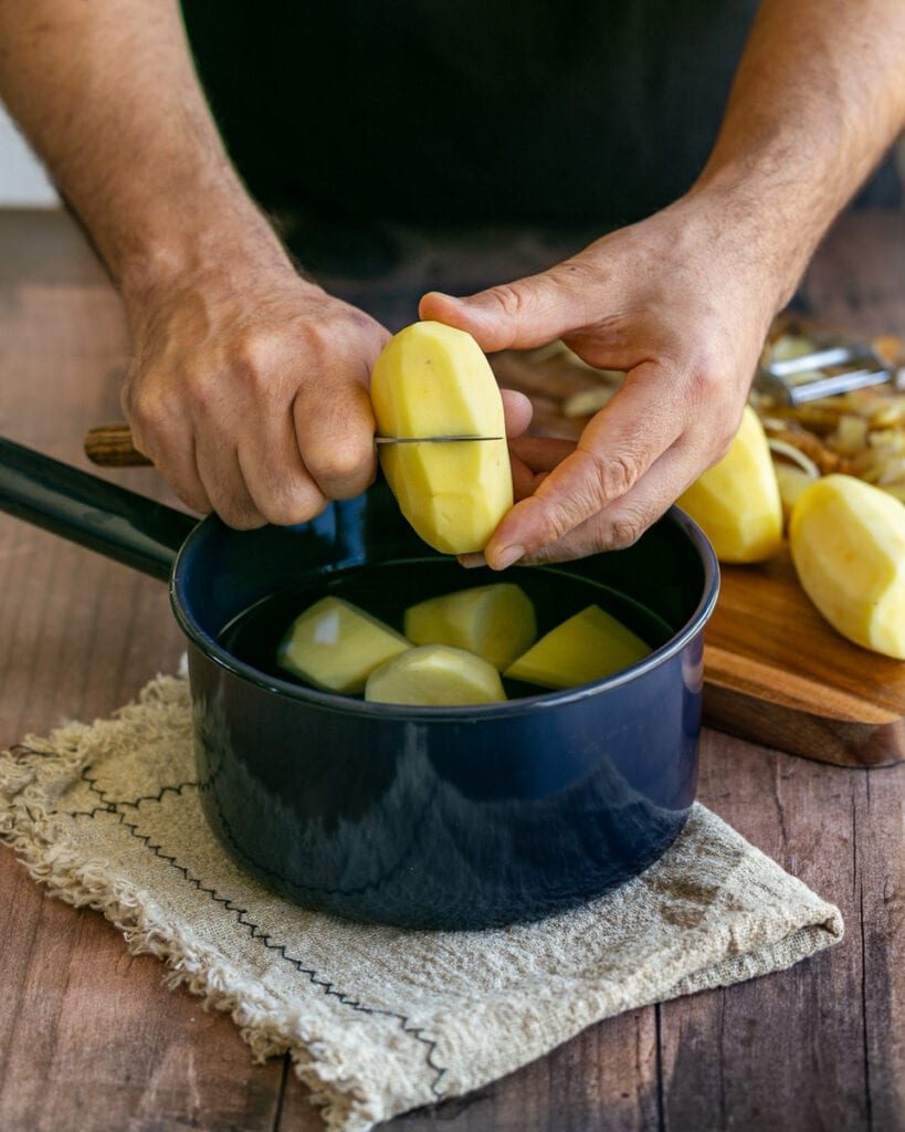 Cutting potato in half 