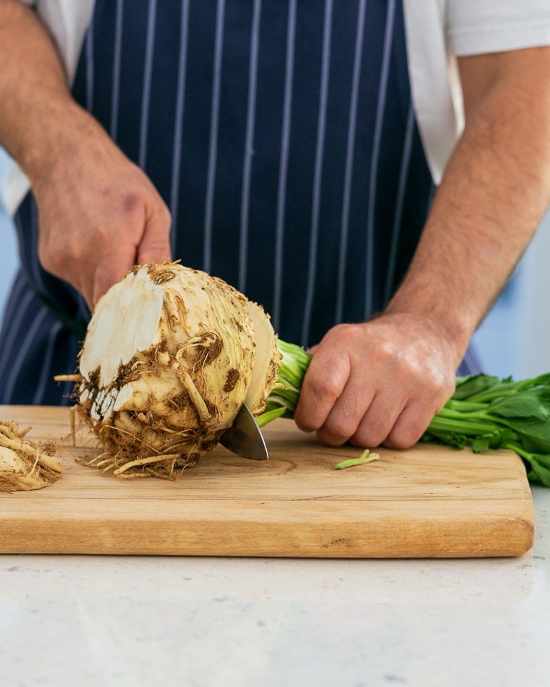 Cutting celeriac to use as garnish for baked trout fillet