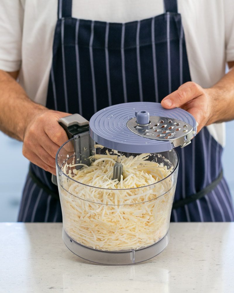 Shredded celeriac in food processor 