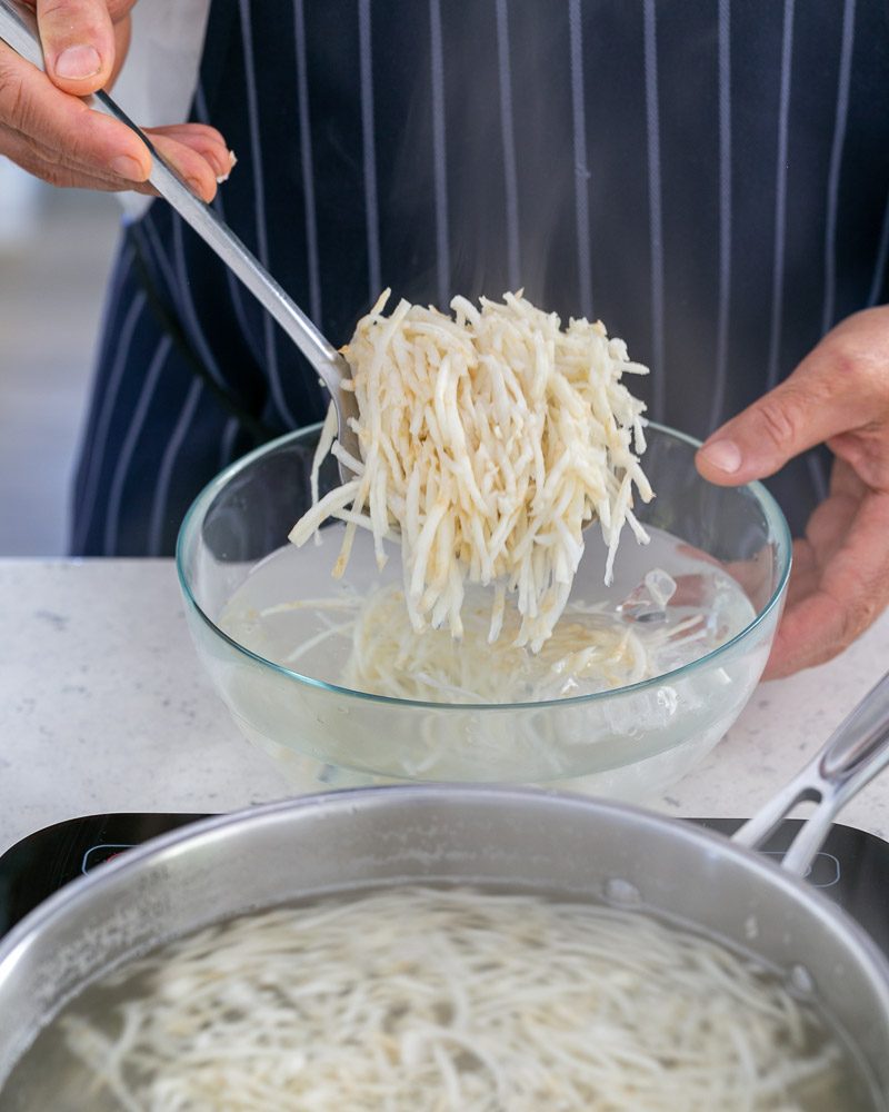 Refreshing blanched celeriac in cold water