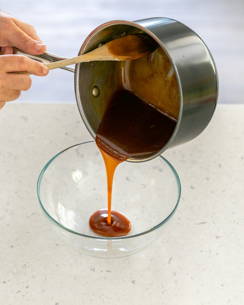 Pouring the prepared caramel into a mixing bowl