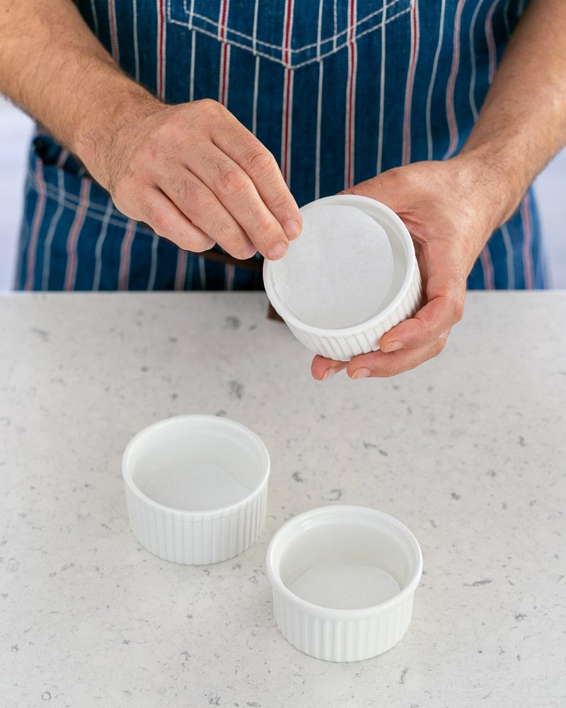 Preparing ramekins for the caramel fondants