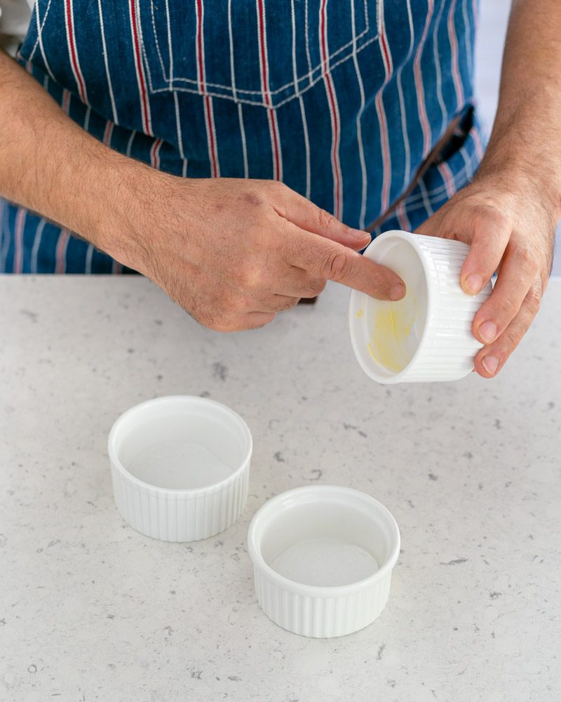 Preparing ramekins for the caramel fondants