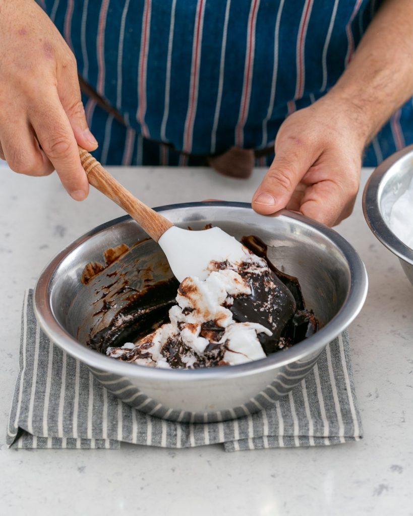 Beaten egg whites folded into melted dark chocolate