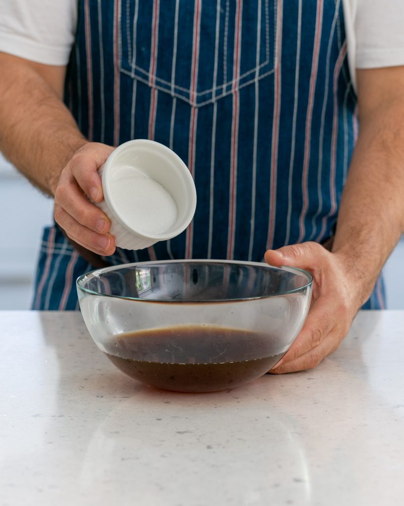 Adding sugar to coffee to make coffee granita