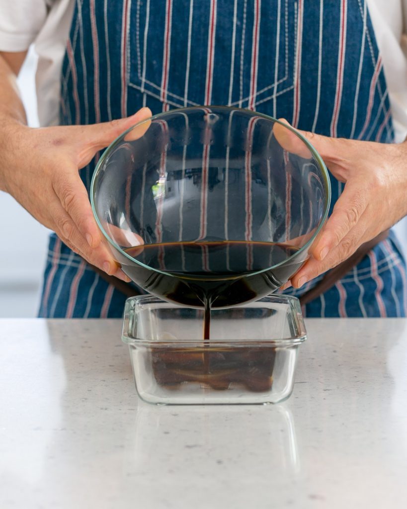 Pouring the coffee mix into baking dish to set in freezer