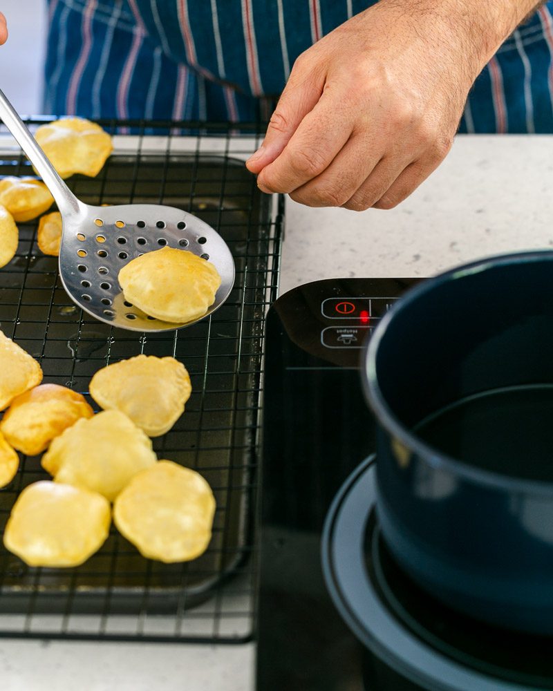 Fried puri balls on sieve