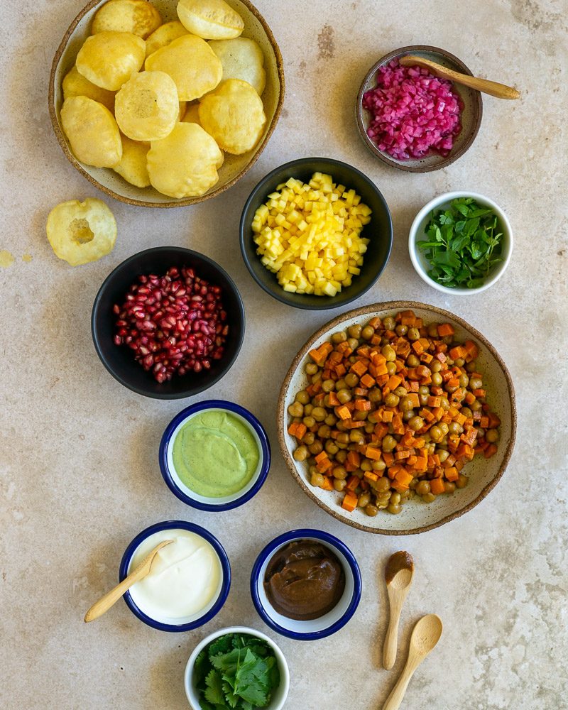 puri chaat bites ingredients with chutneys and condiments for an indian snack