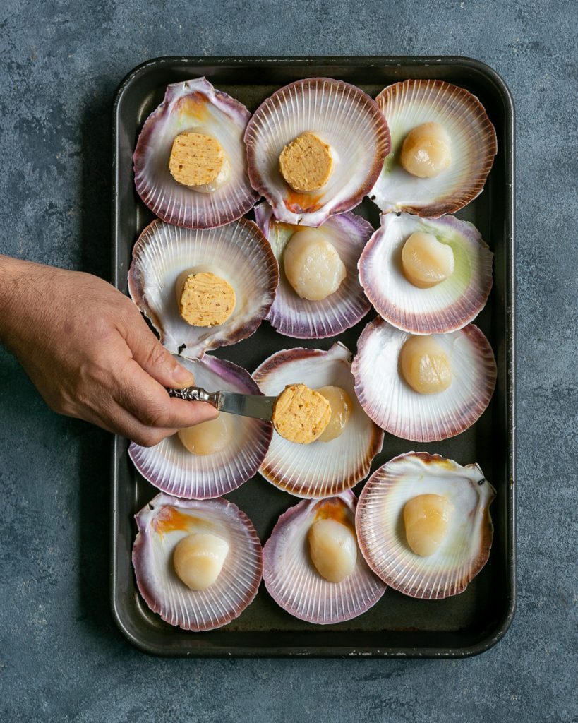 Scallops topped with round discs of the miso ginger butter