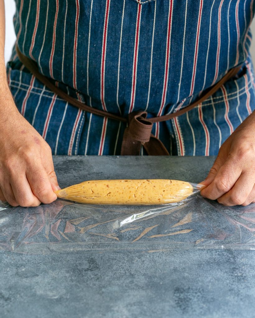 Rolling the miso butter in cling wrap to refrigerate