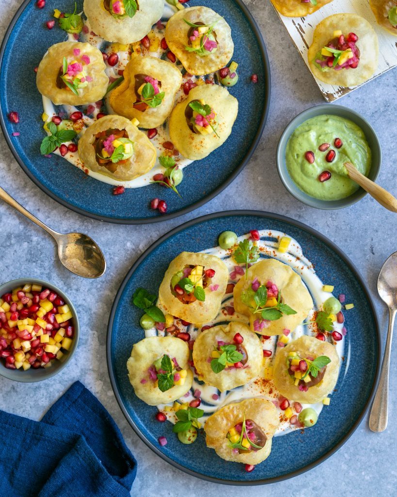 platters with puri chaat bites, an indian snack dish