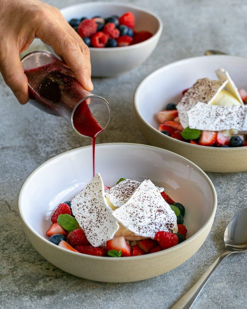 Pouring berry soup into the dessert