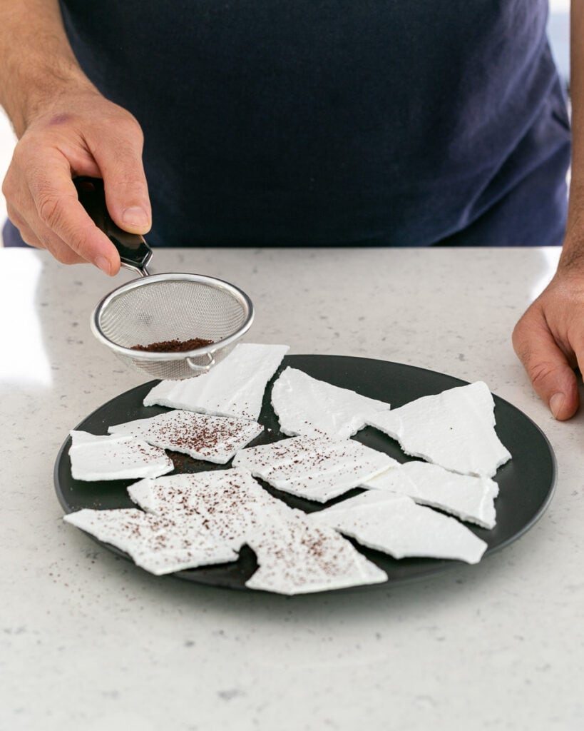 Sumac dusted meringue shards on a plate