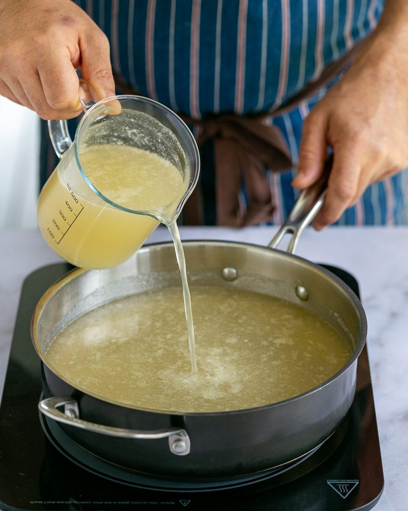 Adding chicken stock to pan to make gravy 