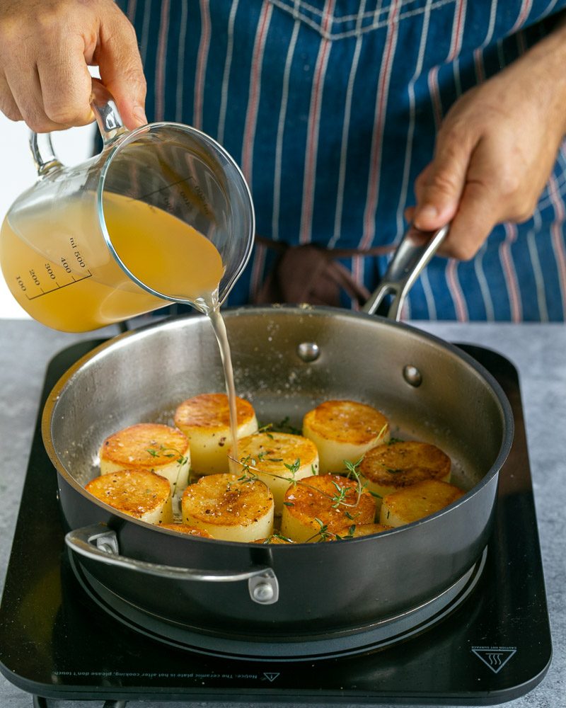 Chicken stock added to cook potatoes