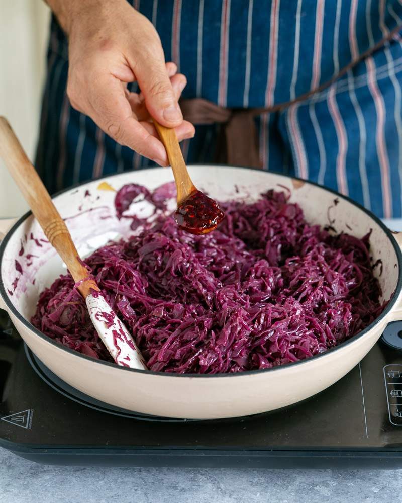 Adding raspberry jam to the braised red cabbage