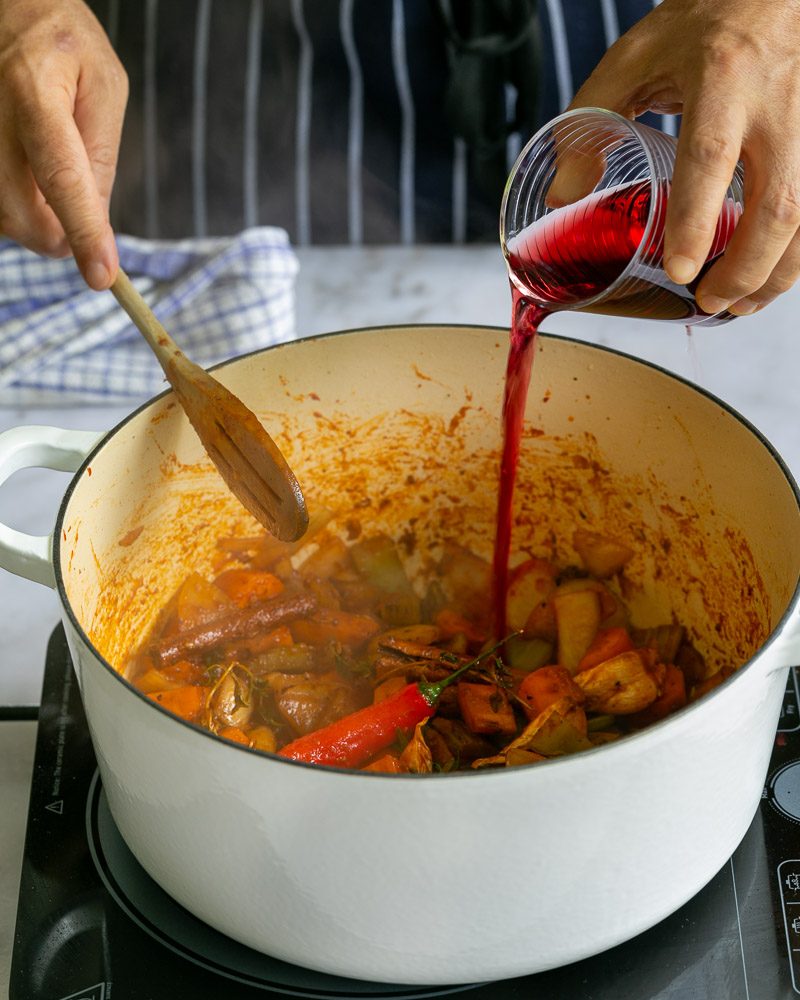 Deglaze pot with red wine