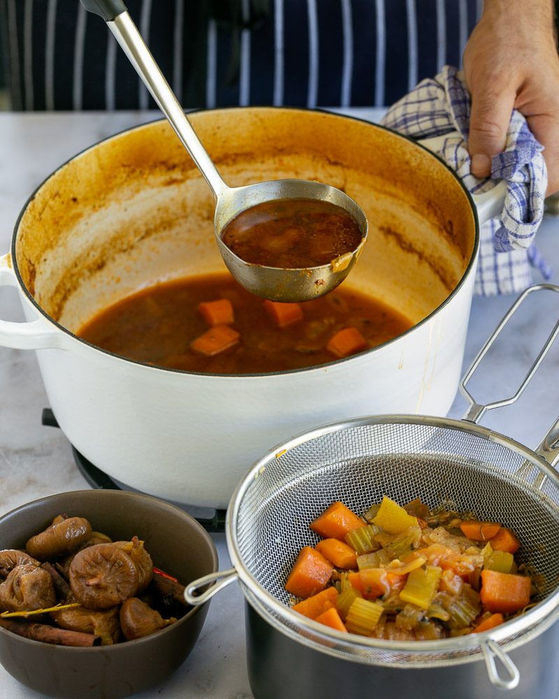 Straining the braising liquid