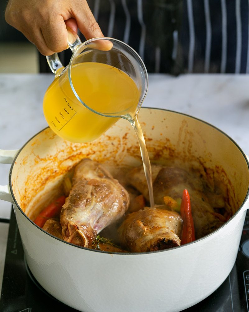 Chicken stock added to cook shanks