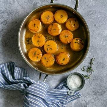 Glazed Fondant Potatoes cooked in a wide pan