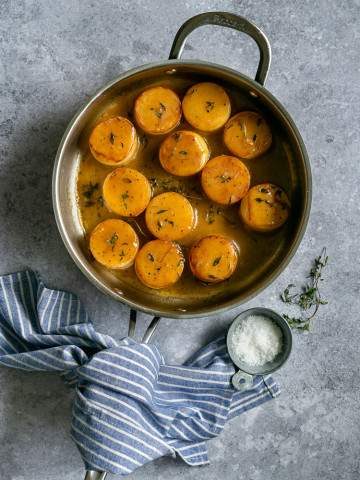 Glazed Fondant Potatoes cooked in a wide pan