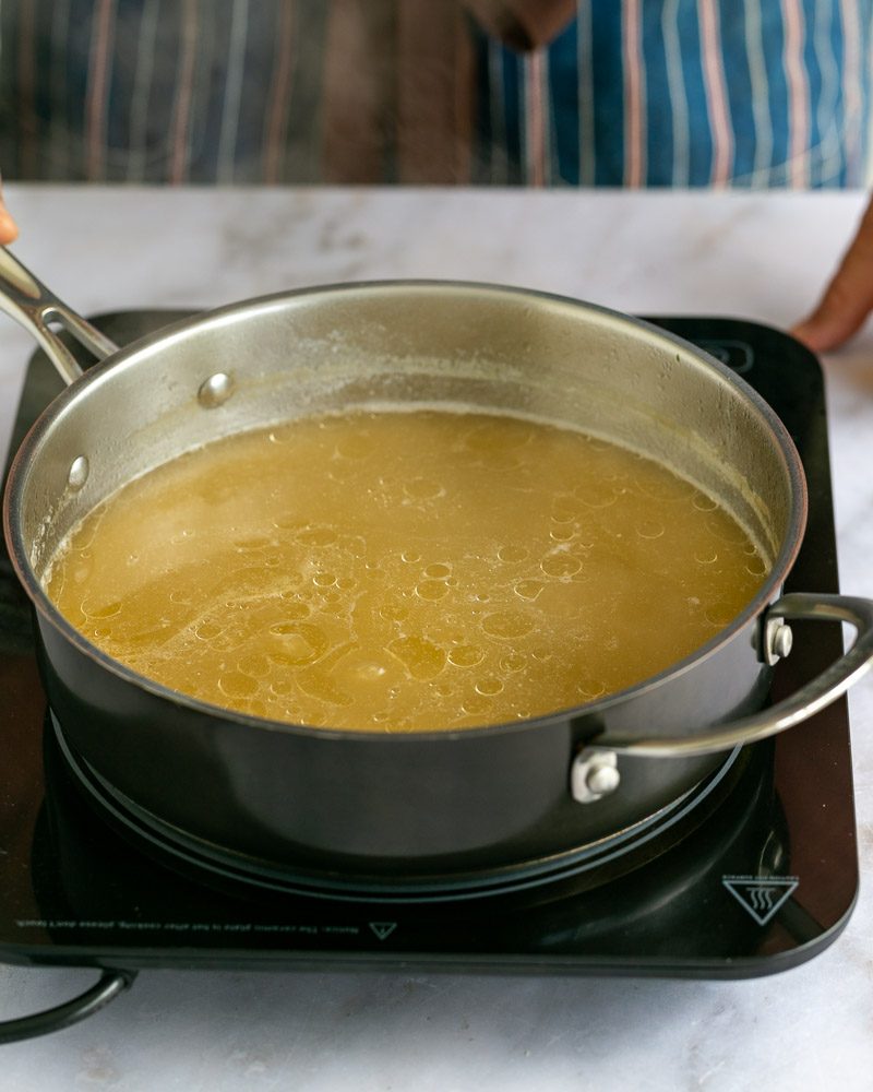 Reducing chicken stock in pan 