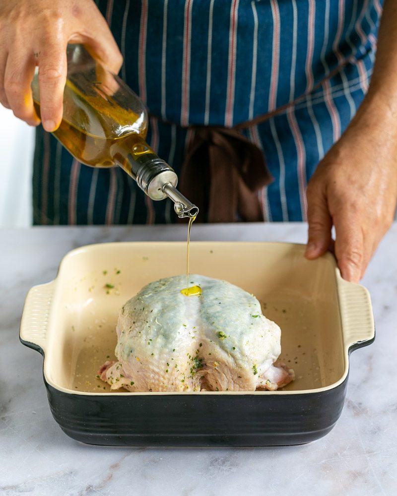 drizzling olive oil on the chicken breasts before baking