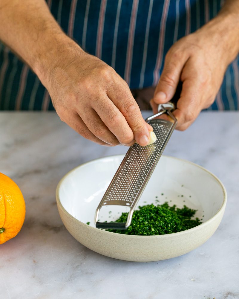 Grating garlic for the gremolata 