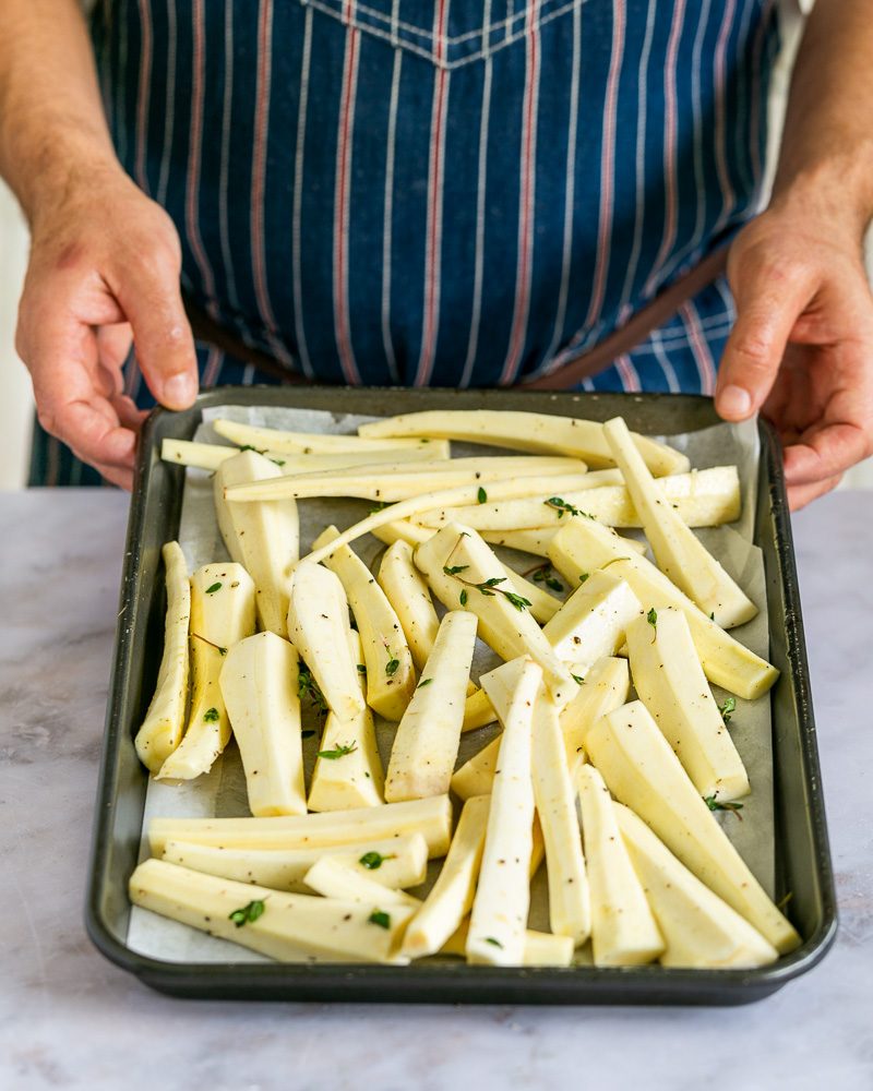 Roasted Parsnip with Orange and Hazelnut Gremolata - Seasoned Parsnip on baking tray