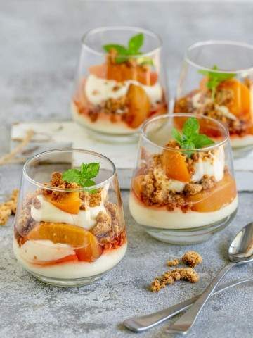 Lemon cheesecake Mousse with Poached Peaches in a glass