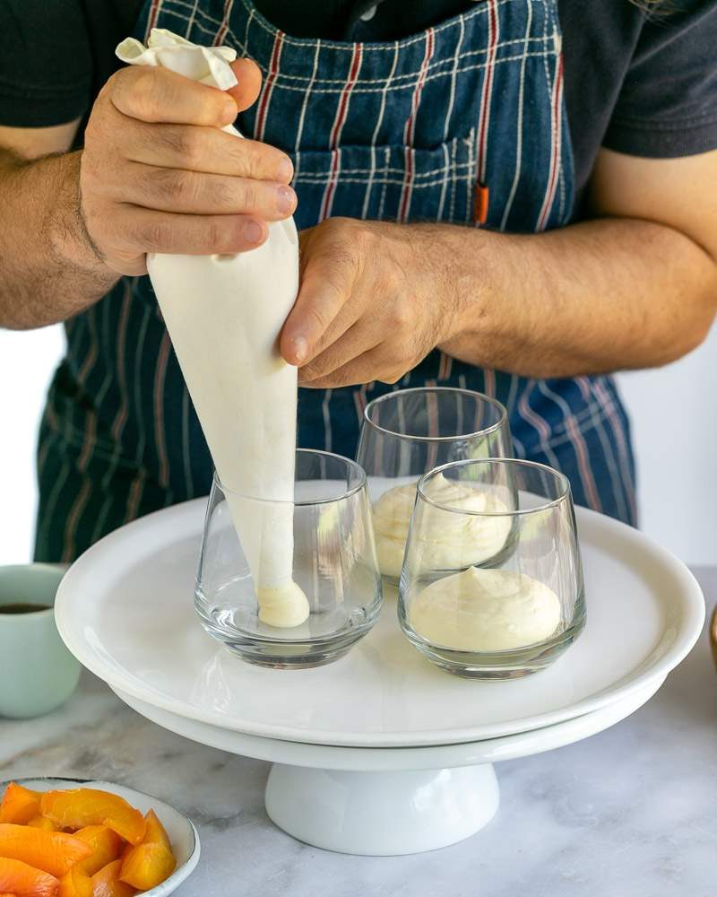 Lemon cheesecake mousse piped into glass