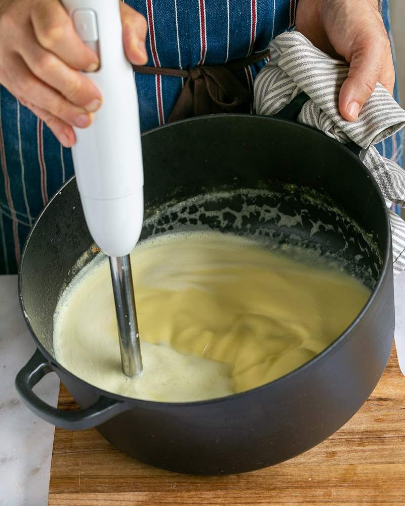 Blending cooked vegetables to make soup