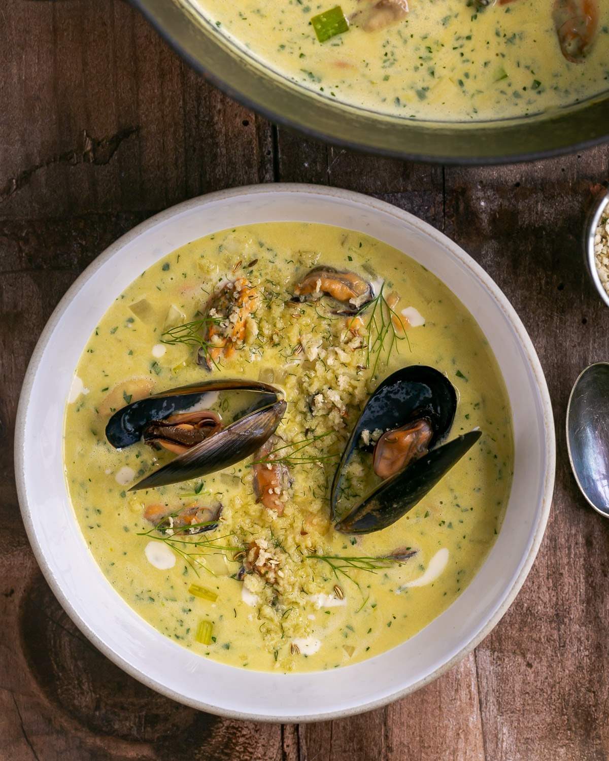 Creamy Mussel and Saffron soup plated in a bowl