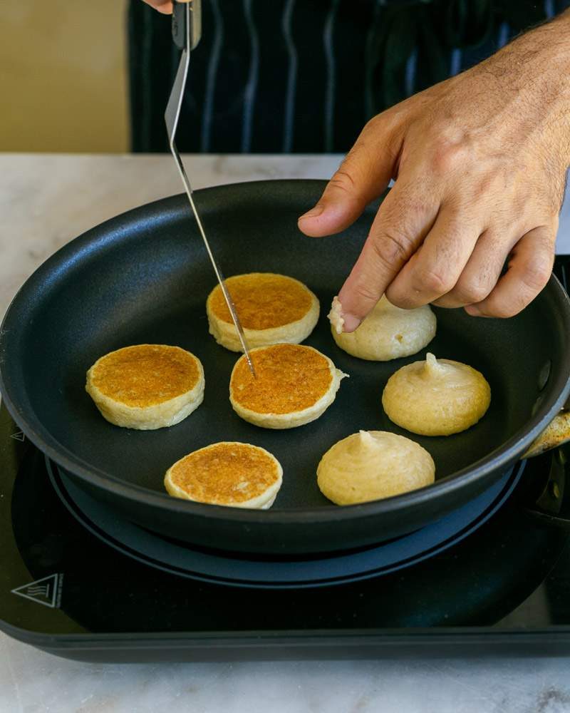 Flipping blinis in pan