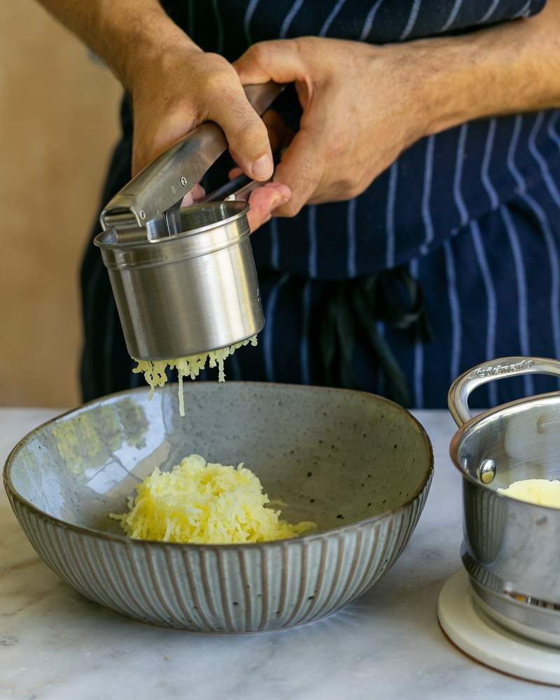 Potatoes in potato ricer