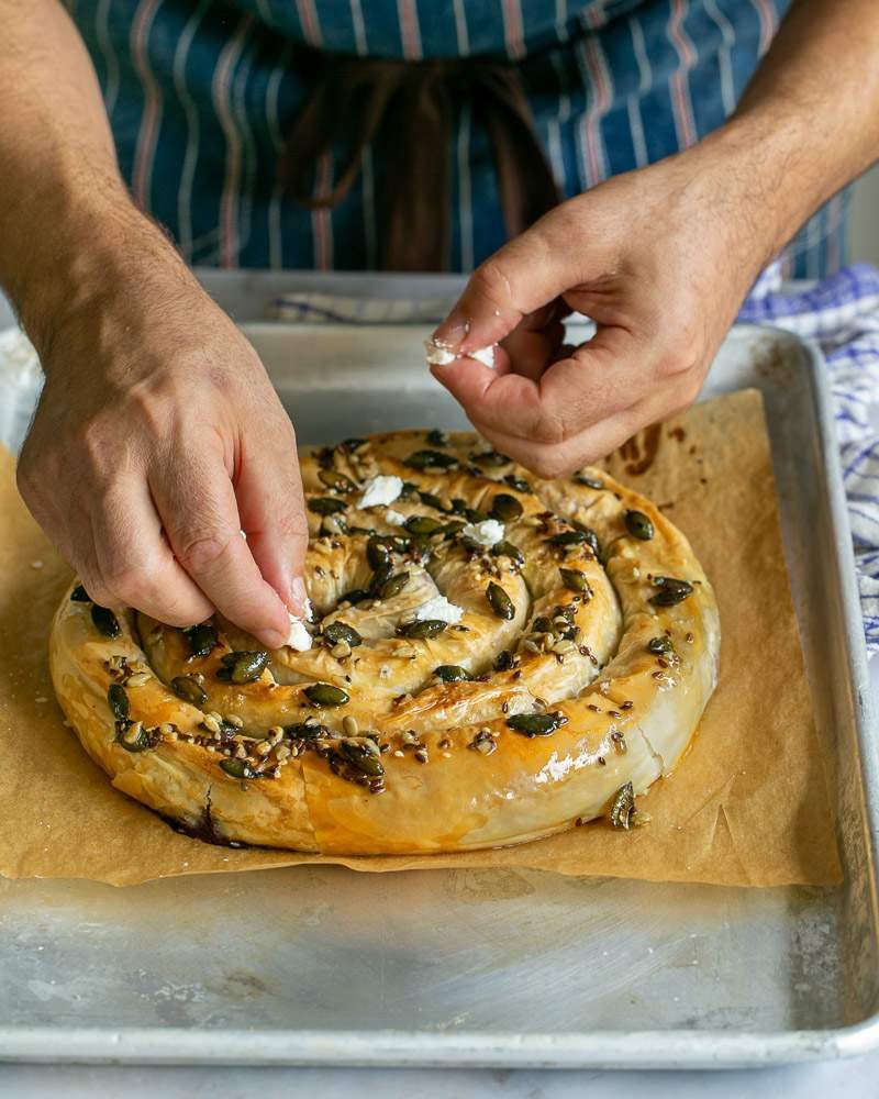 Feta cheese and dill added on top of baked pie