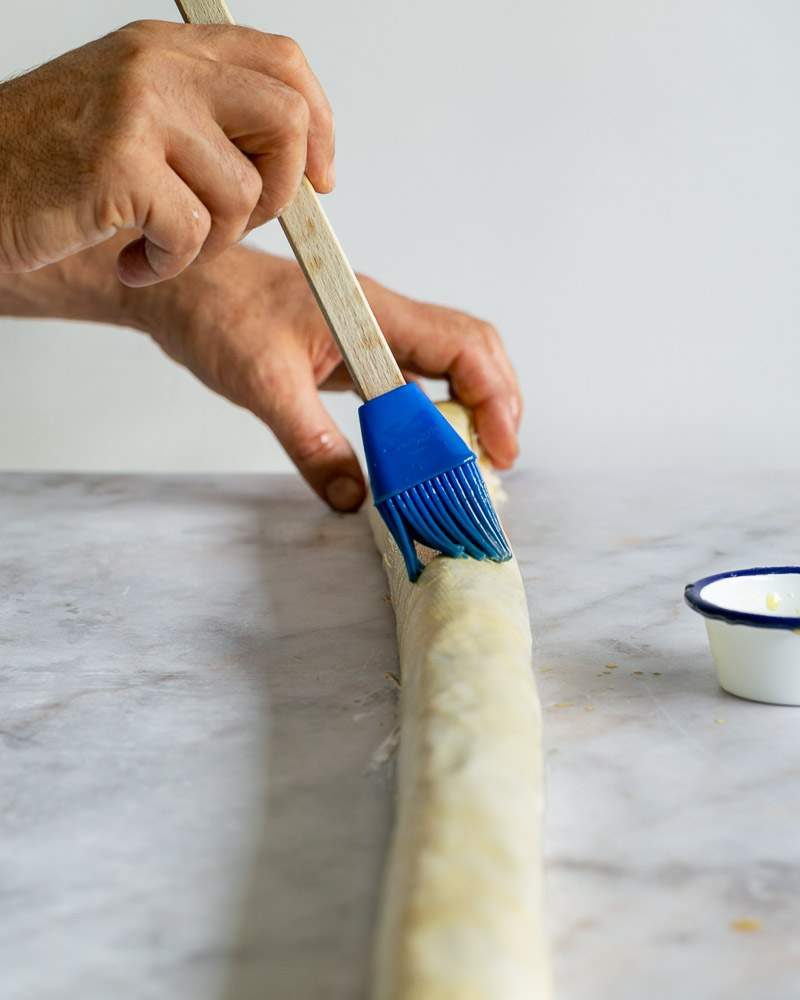 Brushing the filo with melted butter