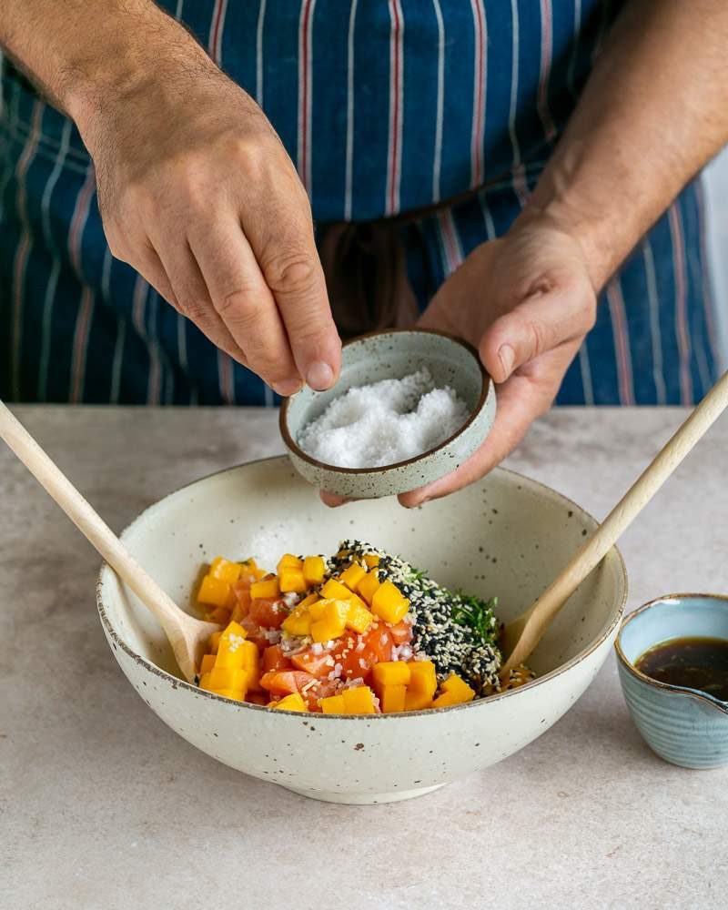 Adding sea salt to the tartare