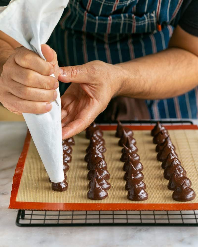 Piping ganache into truffles