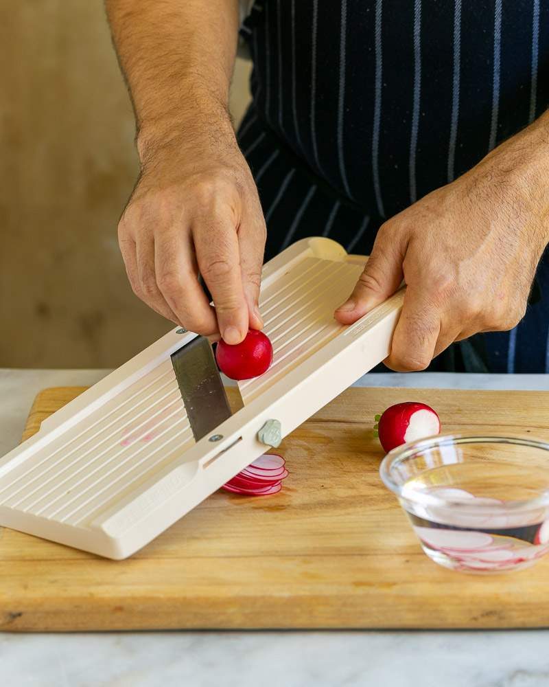 Slicing radish using a mandoline