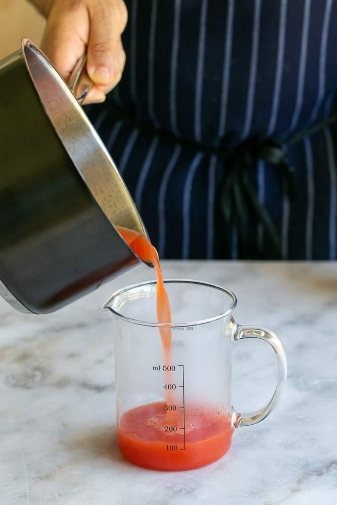 Straining watermelon gazpacho