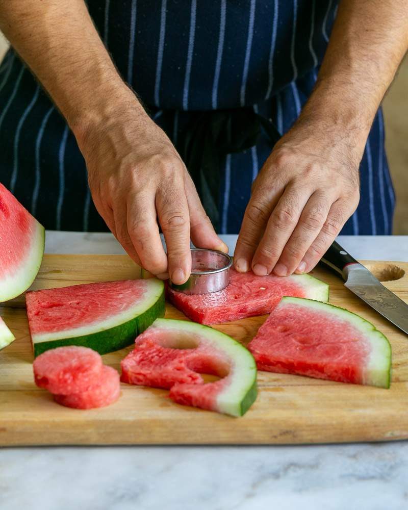 Cutting watermelon for salad
