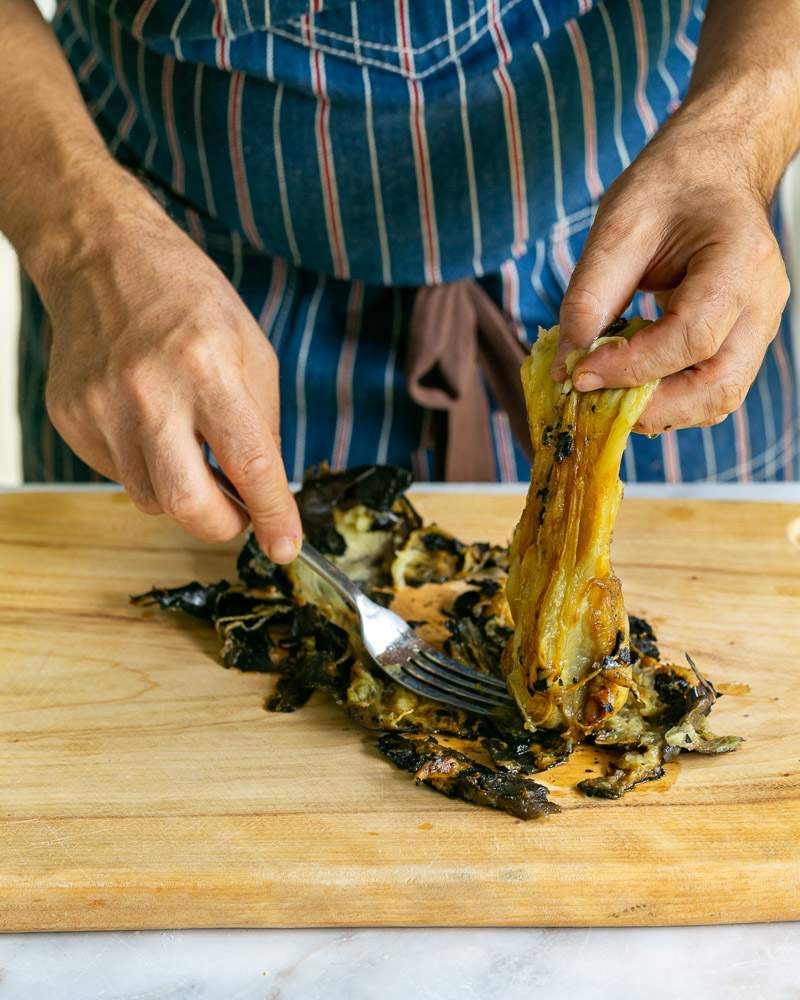 Removing the skin from the roasted eggplant