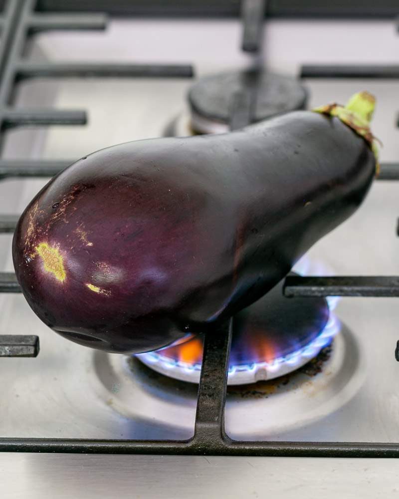 Burning the eggplant for smoky flavour