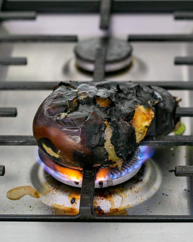 Burning the eggplant for smokey flavour