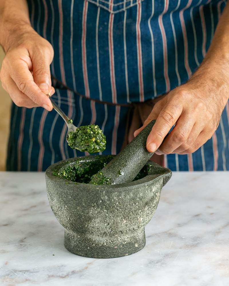 Freshly ground pumpkin seed pesto with a mortar pestle